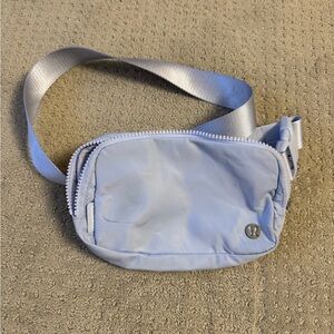 Purple Lululemon belt bag.